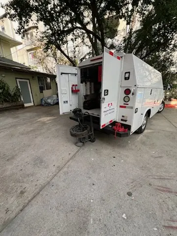 Magnet Plumbing service vehicle on-site for Grease Trap Cleaning in Zimmerman